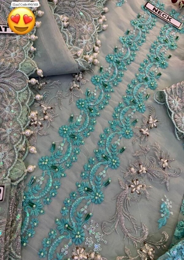 Close-up of embroidered neckline with adda work and stones